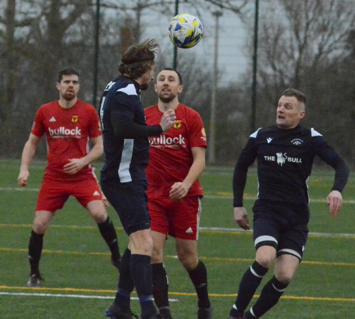 Goal scorer Bridge skipper Nick Squire clears the danger against Carew